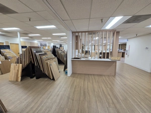 Wood-slat divider between showroom sections