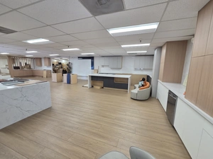 Contemporary white kitchen vignette with seating area at Duro