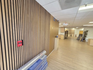 Vertical wood-slat accent wall installation example
