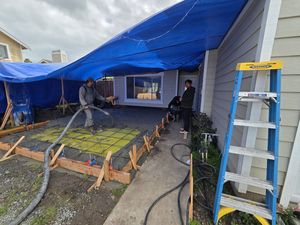 Finishing Concrete Pour Near the Front Entrance