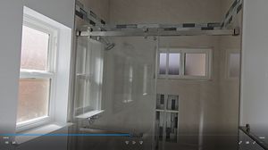 Renovated Bathroom Shower Area with Sliding Glass Doors
