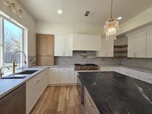 9Builders: Beautifully Finished Kitchen with High-End Appliances and Marble Countertops