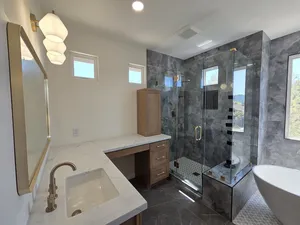 9Builders: Stylish and Luxurious Bathroom Remodel with Gold Fixtures