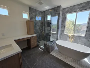 9Builders: Stunning Walk-In Shower with Gold Fixtures and Spacious Design