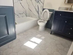 Sleek Bathroom with Modern Vanity and Tiled Shower