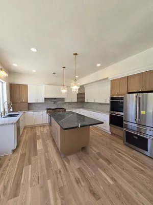 Spacious Kitchen Area with Island and Storage