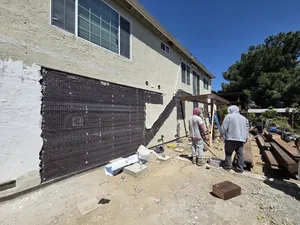 Front view of framed deck structure from backyard