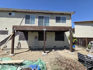 Deck frame assembly in progress with workers
