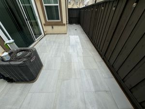 Tiled Walkway Near House with Fresh Landscaping