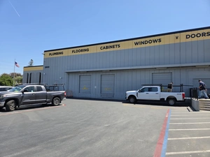Exterior of Contractors' Warehouse showing Plumbing, Flooring, Cabinets, Windows and Doors departments