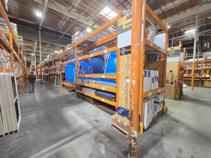 Carpet and rolled flooring storage with blue protective wrap