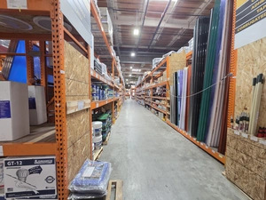 Mixed building supplies aisle with cleaning and finishing products