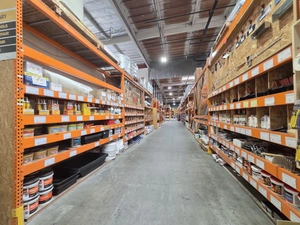 Paint cans aisle stocked floor to top shelf
