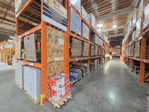 Warehouse interior with stacked boxes and pallets