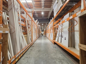Aisle with white siding, trim and finishing materials