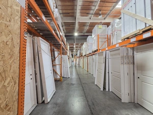 Long pre-hung white door aisle