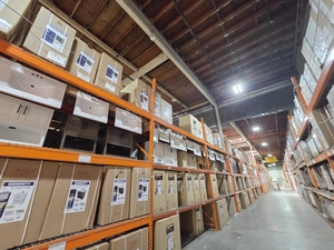 Aisle with stacked bath vanity and cabinet boxes