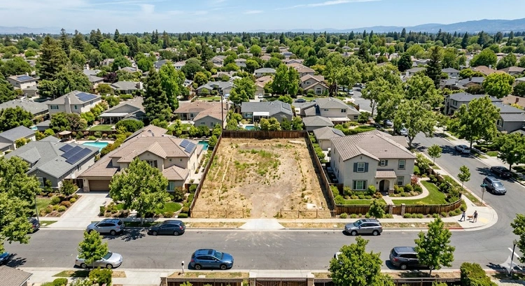 Vacant residential lot in San Jose neighborhood ready for custom home construction