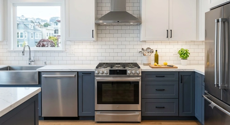 Professional kitchen backsplash tile installation in a Bay Area home showing subway tile layout and grout lines